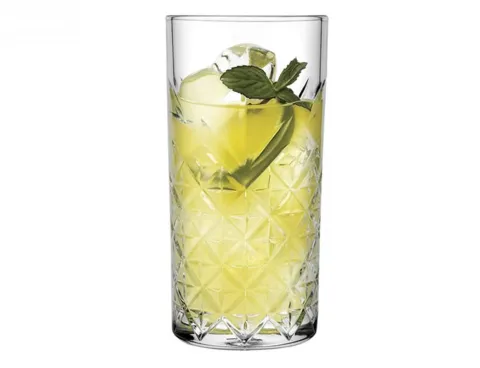 Diamond-patterned glass with a citrus drink and mint